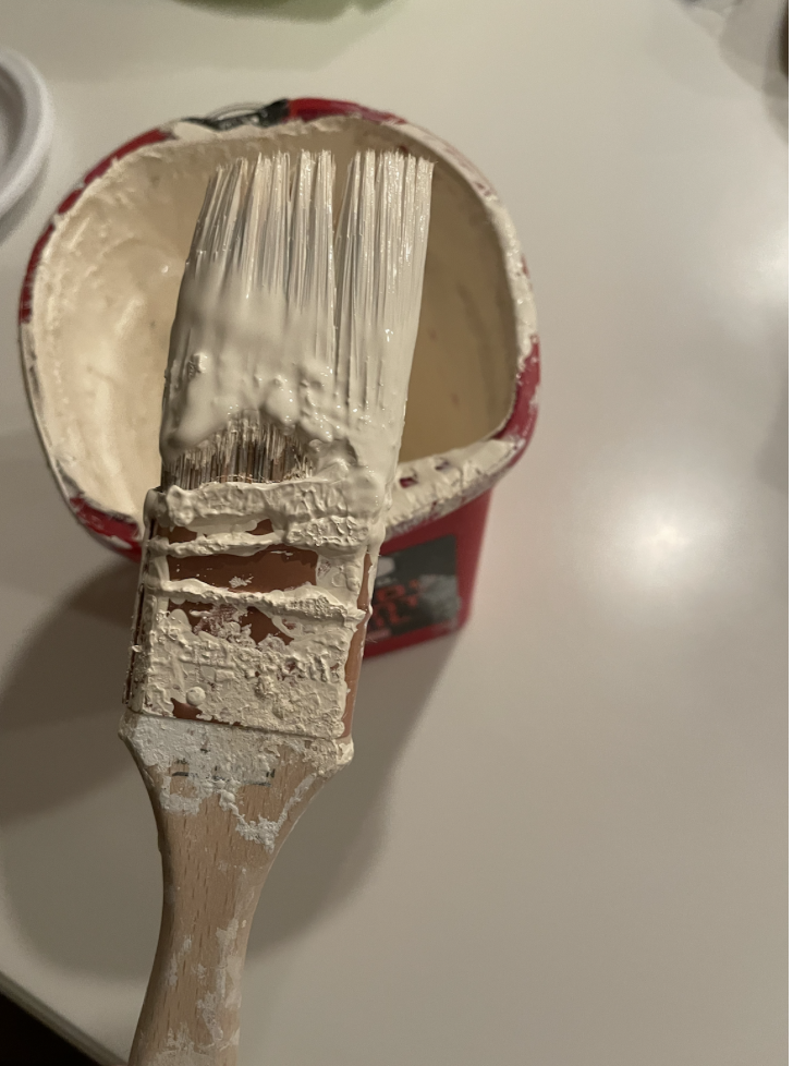 Image of a paint brush with lots of caked on pant. 